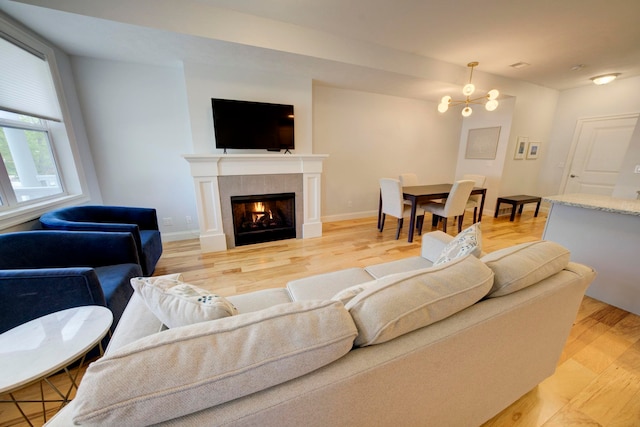 982 Lake Ridge Dr, Traverse City, MI 49684 - living area with a fireplace and light wood-style flooring