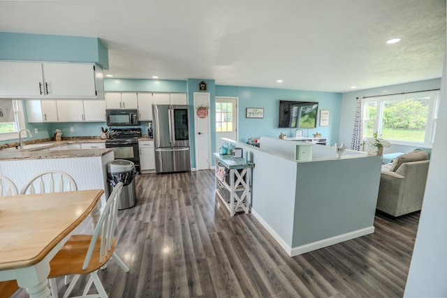 68026 Union Rd S, Union, MI 49130 - kitchen with black appliances, healthy amount of natural light, dark wood-style floors, and recessed lighting