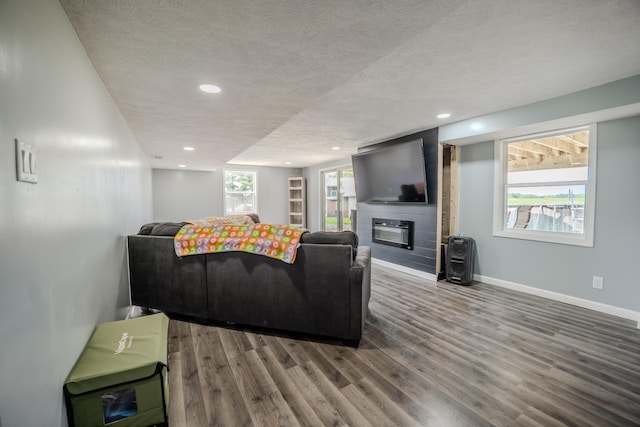68026 Union Rd S, Union, MI 49130 - living room featuring a textured ceiling, wood finished floors, recessed lighting, and a large fireplace