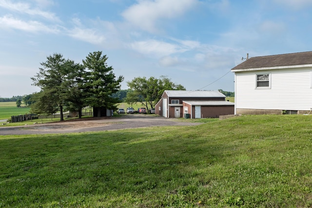 68026 Union Rd S, Union, MI 49130 - view of green lawn featuring a garage and an outbuilding