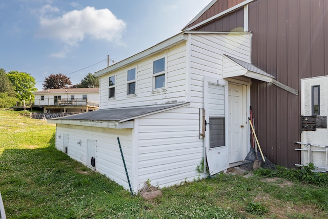 68026 Union Rd S, Union, MI 49130 - view of side of property with a lawn and board and batten siding