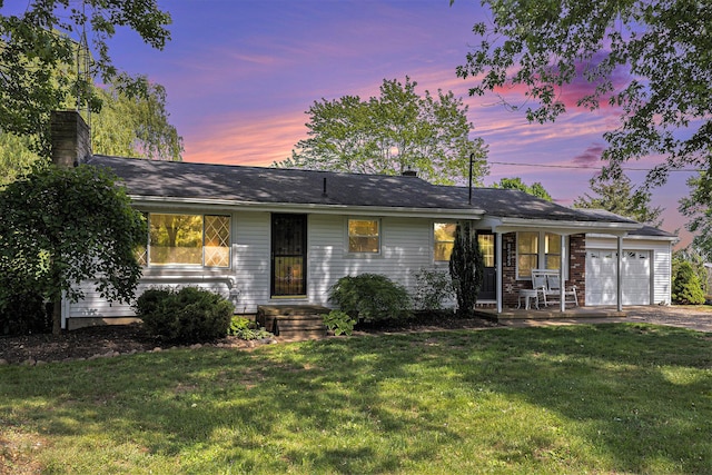 8565 Rives Junction Rd, Rives Junction, MI 49277 - ranch-style house with an attached garage, a yard, a chimney, and driveway