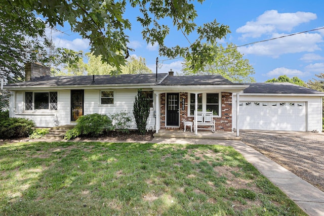 8565 Rives Junction Rd, Rives Junction, MI 49277 - single story home featuring a garage, a chimney, a front lawn, driveway, and covered porch