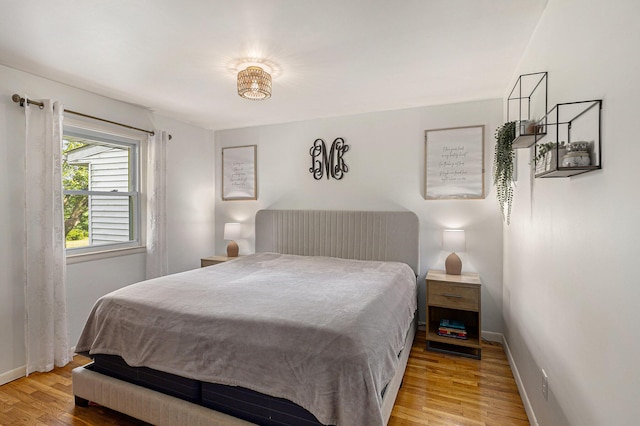 8565 Rives Junction Rd, Rives Junction, MI 49277 - bedroom with light wood-type flooring and baseboards