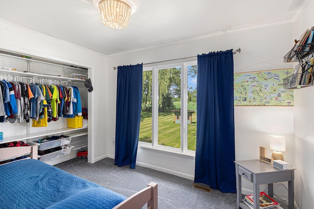 8565 Rives Junction Rd, Rives Junction, MI 49277 - bedroom featuring multiple windows, carpet flooring, a closet, and crown molding