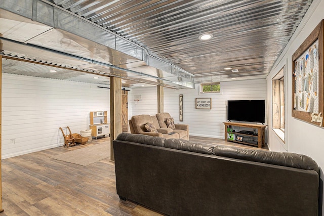 8565 Rives Junction Rd, Rives Junction, MI 49277 - living room featuring wood walls and wood finished floors