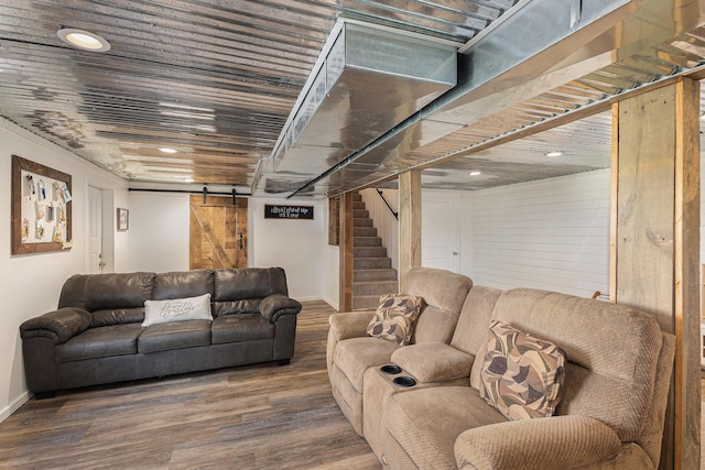 8565 Rives Junction Rd, Rives Junction, MI 49277 - living room featuring a barn door, stairway, wood finished floors, and recessed lighting