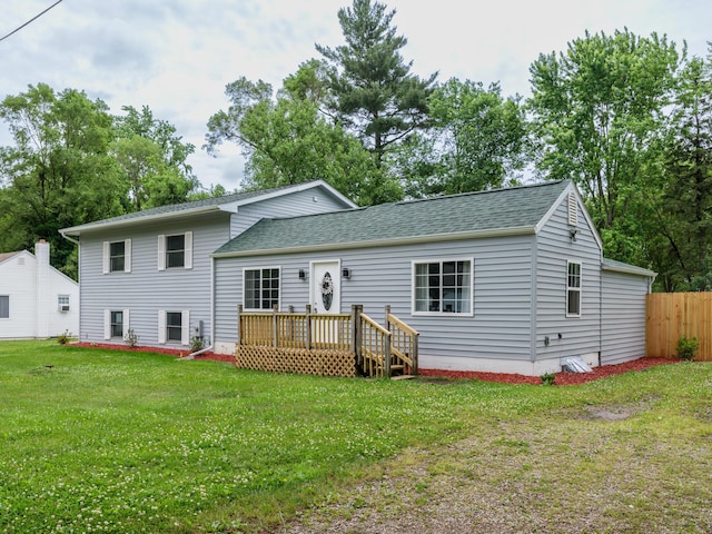 520 Della St, Portage, MI 49002 - back of house with a shingled roof and a deck