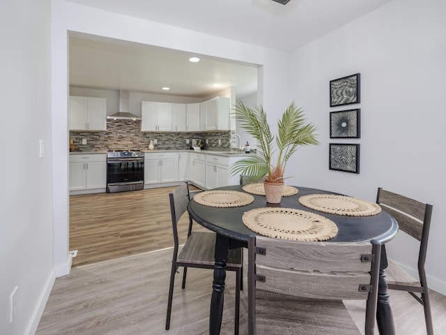 520 Della St, Portage, MI 49002 - dining space with light wood-style flooring and recessed lighting