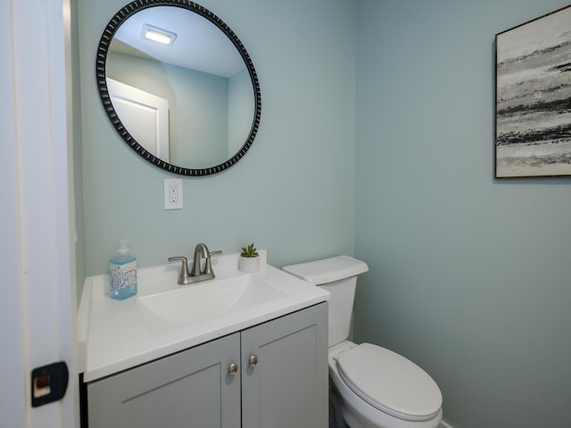 520 Della St, Portage, MI 49002 - half bathroom featuring vanity and toilet