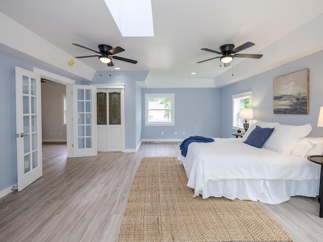 520 Della St, Portage, MI 49002 - bedroom featuring french doors, wood finished floors, and a ceiling fan