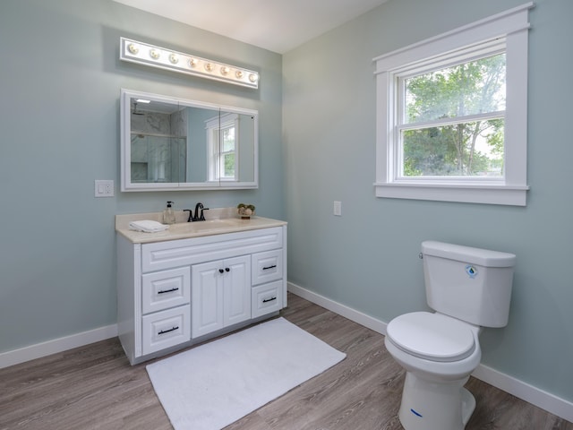 520 Della St, Portage, MI 49002 - full bath with vanity, wood finished floors, and a shower