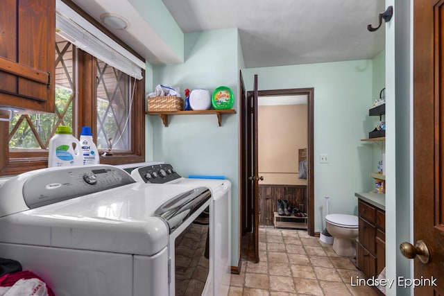 10201 Fillmore St, Zeeland, MI 49464 - washroom with stone tile floors and washer and clothes dryer