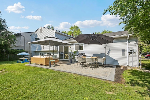 9241 Abbey Ln, Ypsilanti, MI 48198 - back of house featuring a patio area and an outdoor living space