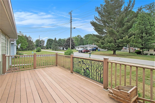 6779 1st Dr, Coloma, MI 49038 - wooden deck with a lawn and view of scattered trees