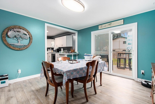 6779 1st Dr, Coloma, MI 49038 - dining space featuring light wood-type flooring and ornamental molding