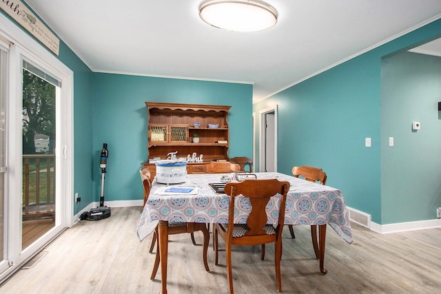 6779 1st Dr, Coloma, MI 49038 - dining room featuring wood finished floors and ornamental molding