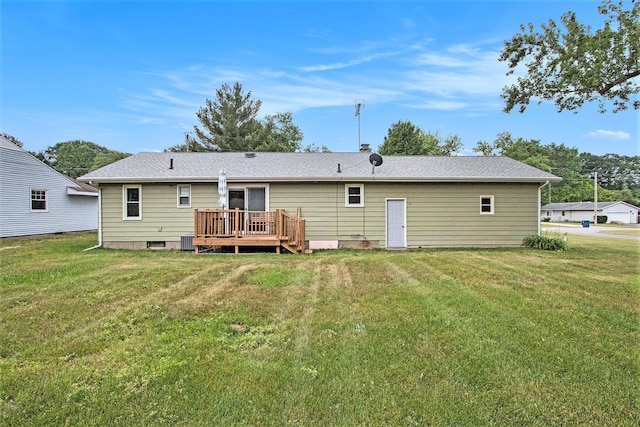 6779 1st Dr, Coloma, MI 49038 - back of house featuring a wooden deck and a lawn