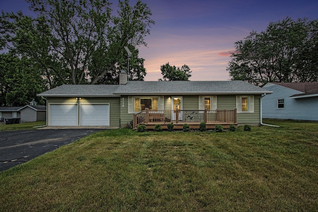 6779 1st Dr, Coloma, MI 49038 - ranch-style house featuring a garage, asphalt driveway, a front lawn, and a chimney