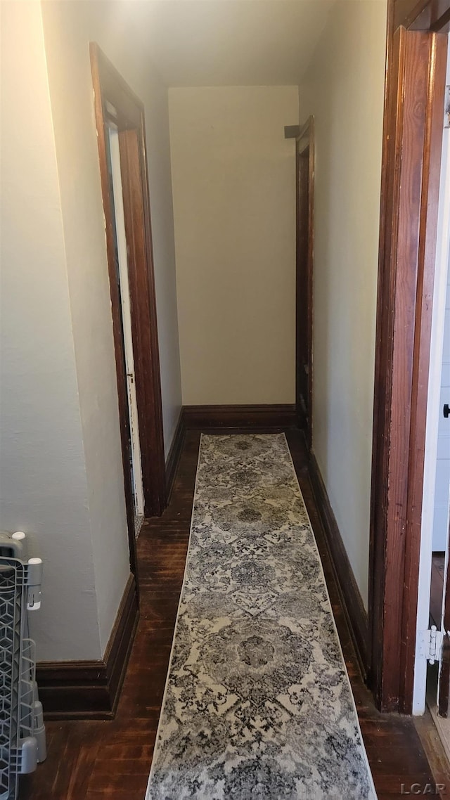 511 E Main St, Morenci, MI 49256 - corridor featuring dark wood-style flooring and baseboards
