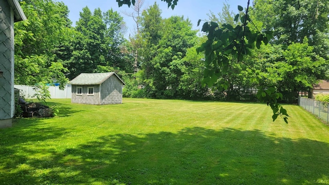 511 E Main St, Morenci, MI 49256 - fenced backyard featuring a storage unit