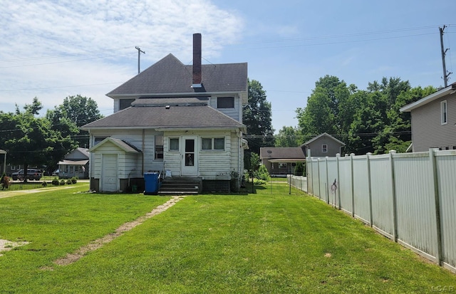 511 E Main St, Morenci, MI 49256 - rear view of property with roof with shingles and a chimney