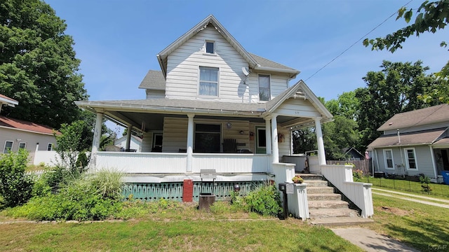 511 E Main St, Morenci, MI 49256 - view of front of house with covered porch and a shingled roof