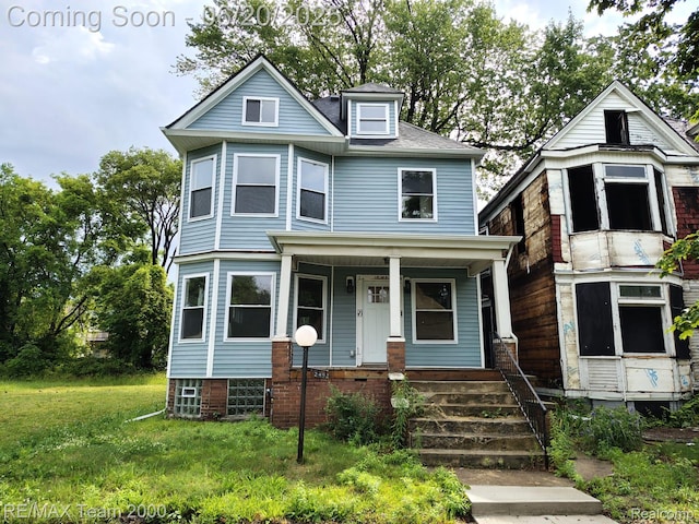 2492 Townsend St, Detroit, MI 48214 - view of front of house featuring a porch and a front lawn