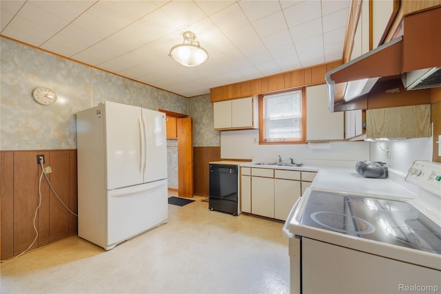 29463 Sibley Rd, Romulus, MI 48174 - kitchen featuring white appliances, wainscoting, wallpapered walls, wooden walls, and light countertops