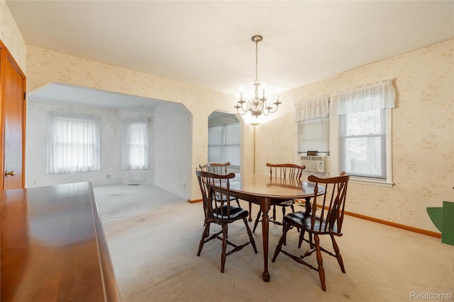 29463 Sibley Rd, Romulus, MI 48174 - dining area with wallpapered walls, plenty of natural light, a chandelier, light carpet, and cooling unit