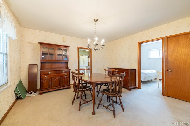 29463 Sibley Rd, Romulus, MI 48174 - dining area featuring wallpapered walls, a chandelier, and light colored carpet