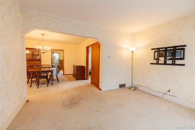 29463 Sibley Rd, Romulus, MI 48174 - unfurnished dining area featuring arched walkways, wallpapered walls, carpet flooring, and a chandelier