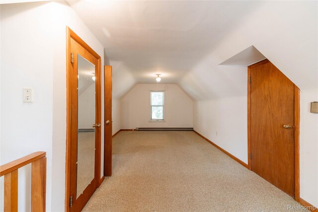 29463 Sibley Rd, Romulus, MI 48174 - additional living space with carpet floors, a baseboard heating unit, and lofted ceiling