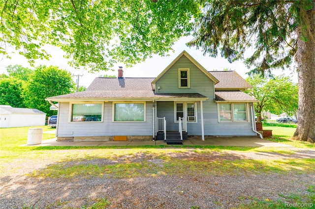 29463 Sibley Rd, Romulus, MI 48174 - view of front facade with a chimney and roof with shingles