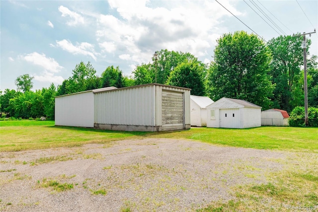 29463 Sibley Rd, Romulus, MI 48174 - view of grassy yard with an outdoor structure and view of scattered trees
