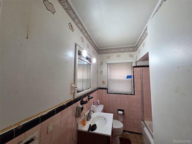 19466 Packard St, Detroit, MI 48234 - full bathroom featuring vanity, tile walls, bathtub / shower combination, wainscoting, and tile patterned floors