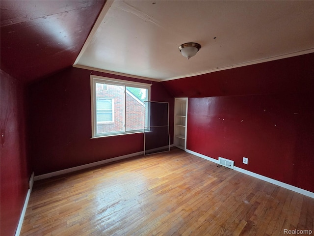 19466 Packard St, Detroit, MI 48234 - additional living space featuring vaulted ceiling and hardwood / wood-style floors