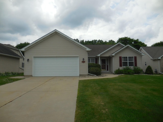8103 Robinbrook St, Richland, MI 49083 - ranch-style house featuring a garage, concrete driveway, and a front yard
