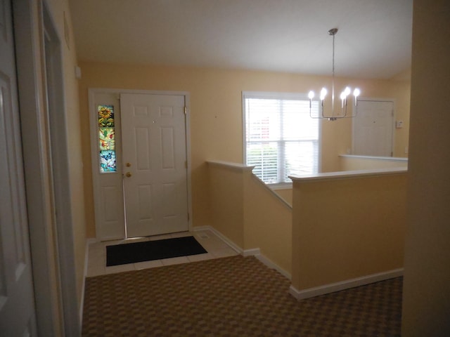 8103 Robinbrook St, Richland, MI 49083 - carpeted entrance foyer featuring a chandelier and baseboards