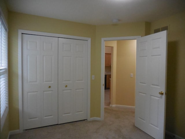 8103 Robinbrook St, Richland, MI 49083 - unfurnished bedroom featuring light colored carpet and a closet