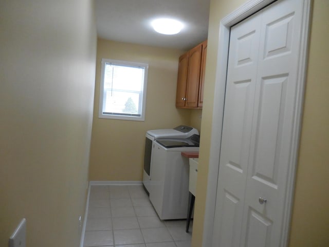 8103 Robinbrook St, Richland, MI 49083 - laundry room featuring washer and dryer, light tile patterned floors, and cabinet space