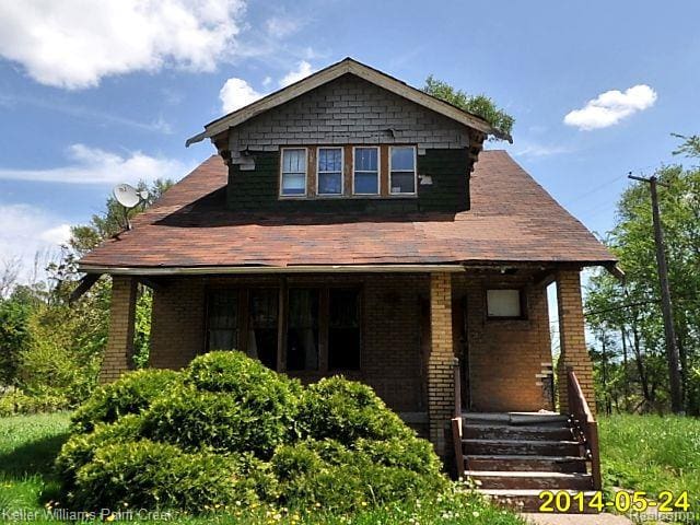 17160 Conley St, Hamtramck, MI 48212 - view of front of property featuring a porch and brick siding