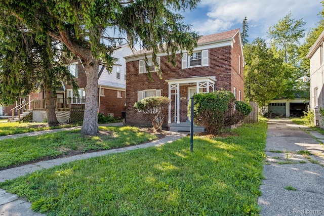 11487 Kenmoor St, Detroit, MI 48205 - view of front of home featuring brick siding and a front lawn