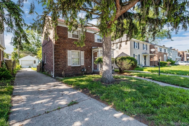 11487 Kenmoor St, Detroit, MI 48205 - multi unit property with a detached garage, brick siding, an outdoor structure, a residential view, and a front lawn