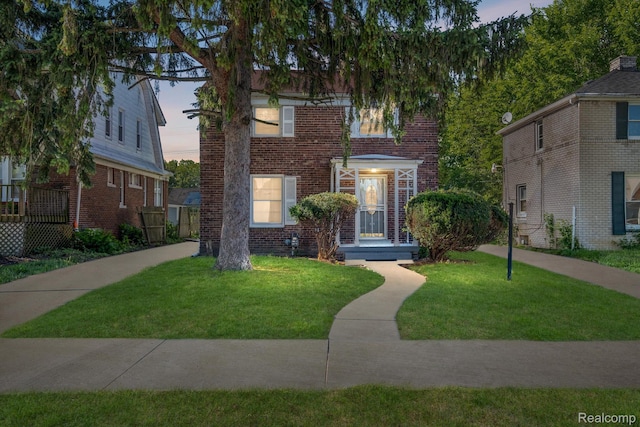 11487 Kenmoor St, Detroit, MI 48205 - traditional home featuring a front yard and brick siding