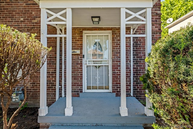 11487 Kenmoor St, Detroit, MI 48205 - view of exterior entry with brick siding and covered porch