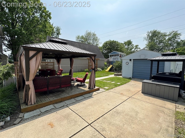 4235 Bacon Ave, Berkley, MI 48072 - view of patio featuring a gazebo, an outdoor hangout area, a playground, a detached garage, and a deck