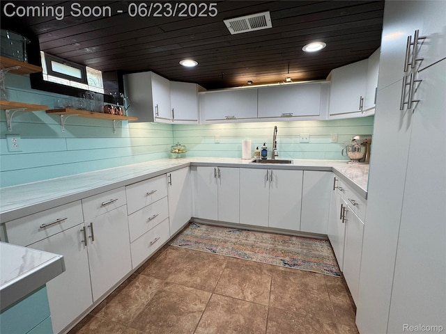 4235 Bacon Ave, Berkley, MI 48072 - kitchen featuring open shelves, white cabinetry, light countertops, wooden ceiling, and recessed lighting