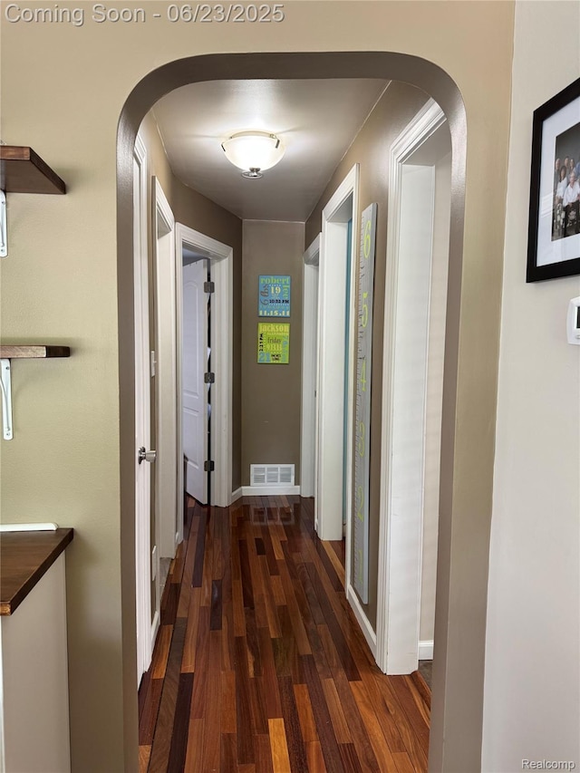 4235 Bacon Ave, Berkley, MI 48072 - hall with arched walkways and dark wood finished floors