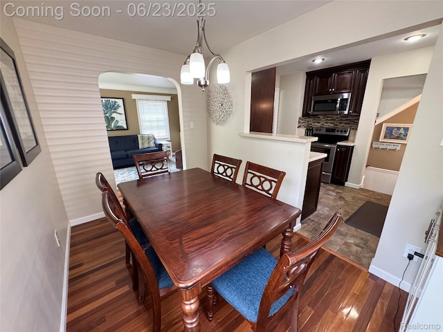 4235 Bacon Ave, Berkley, MI 48072 - dining room with dark wood-style floors and arched walkways